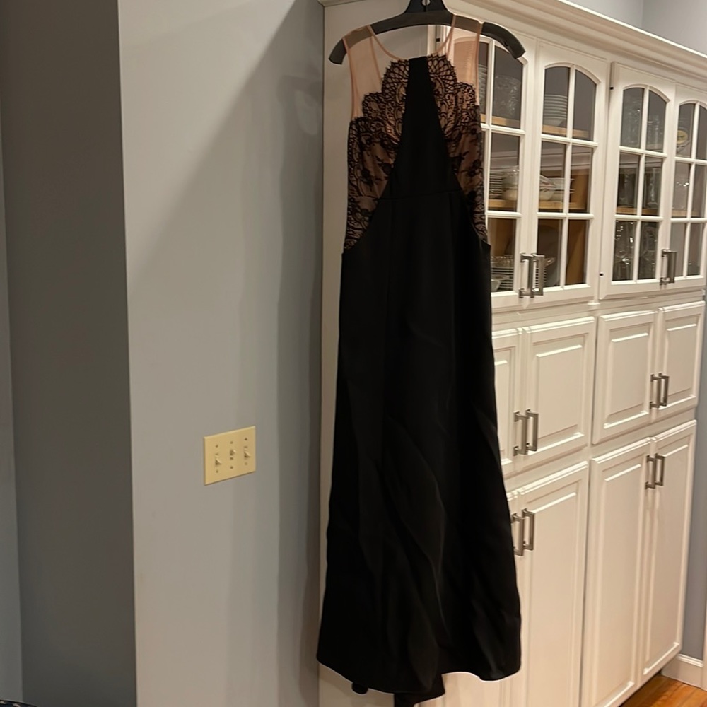 BCBG MaxAzria sz 0 prom dress. Black trumpet with pockets and illusion neckline